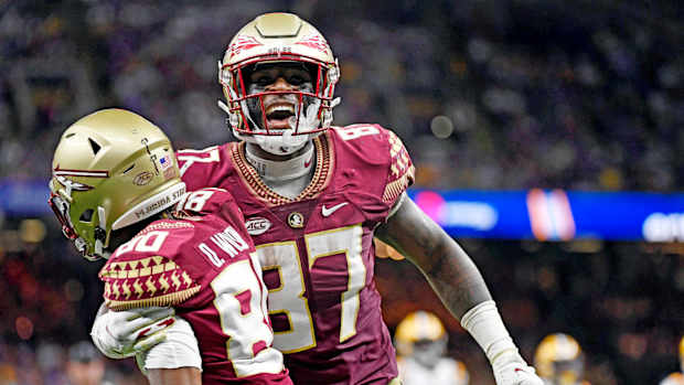 Sep 4, 2022; New Orleans, Louisiana, USA; Florida State Seminoles tight end Camren McDonald (87) celebrates with wide receiver Ontaria Wilson (80) after scoring a touchdow during the first half against the Louisiana State Tigers at Caesars Superdome.